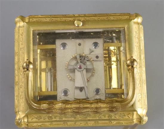 A late 19th century French ormolu quarter repeating carriage alarum clock, 5.75in., with leather travelling case